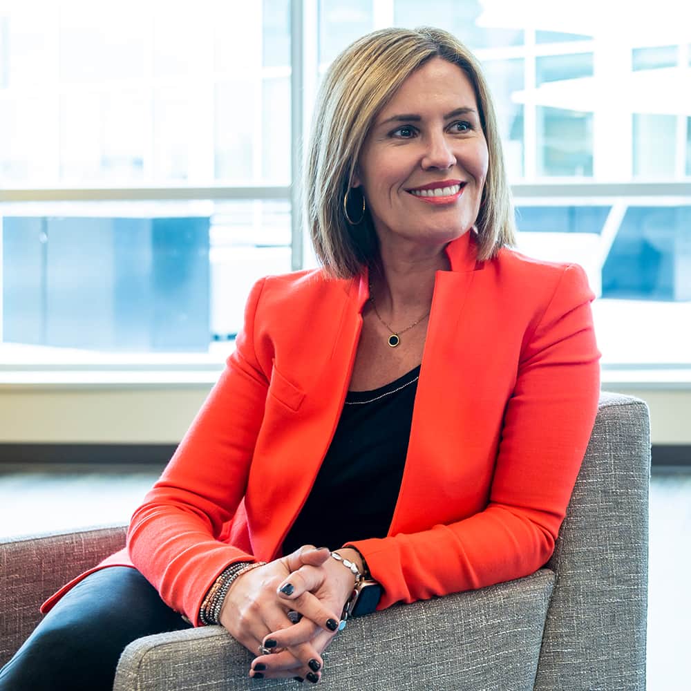 Ruth Harper sitting in a chair