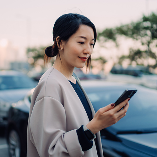 woman looking at her cell phone